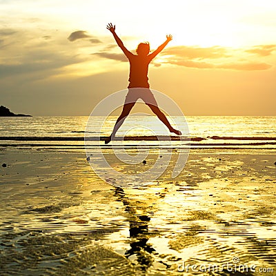 Silhouette of young jumping girl