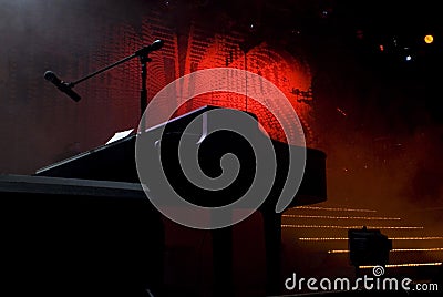 Silhouetted Piano Shape on Stage