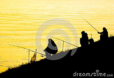 Silhouettes of fishing men