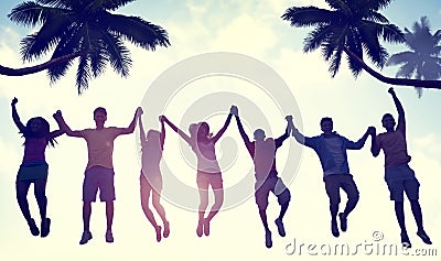 Silhouettes of People Jumping by the Beach