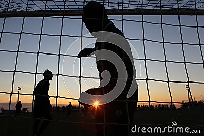 Silhouettes of soccer players