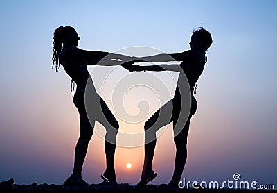 Silhouettes of two women