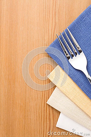Silver fork and knife on napkin
