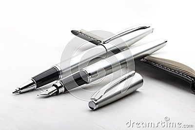 Silver fountain pen and roller pen
