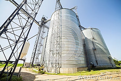 Silver, shiny agricultural silos