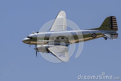 Silver vintage war plane in air