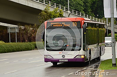 Singapore SBS public bus on road approaches bus stop