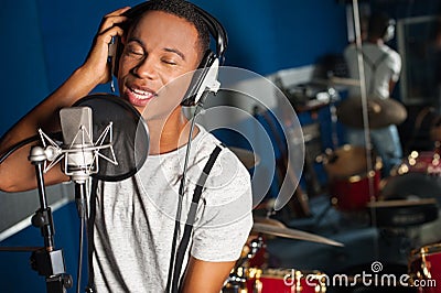 Singer recording a track in studio
