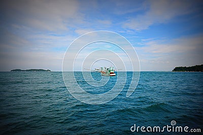 Single fishing boat in the middle of sea