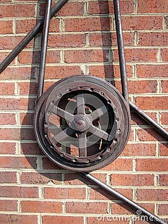 Single Gear Against Brick Wall