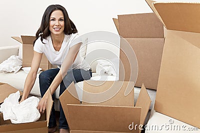 Single Woman Unpacking Boxes Moving House
