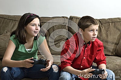 Sister and brother playing a video game