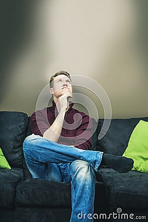 Sitting on sofa thinking