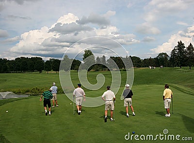 Six golfers on golf course