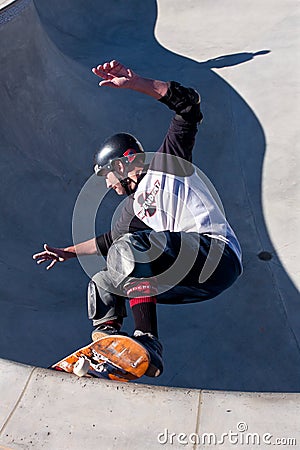 Skateboarder Skates In Big Bowl