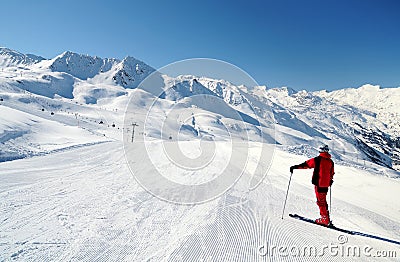 Skier enjoying mountain view at ski track