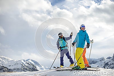 Skier showing friends the mountain tops