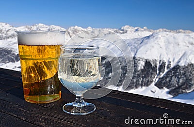 Skiing resort. Glasses with beer and white wine.