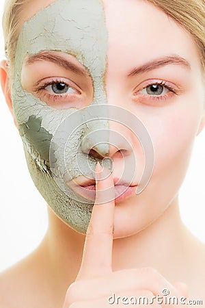 Skin care. Woman in clay mud mask on face. Beauty.