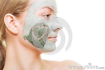 Skin care. Woman in clay mud mask on face. Beauty.