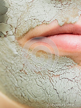 Skin care. Woman in clay mud mask on face. Beauty.