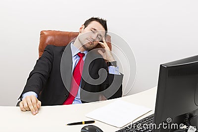Sleeping businessman at work