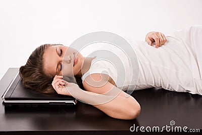 Sleeping girl lying on the office table