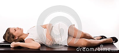 Sleeping girl lying on the office table