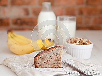 A slice of banana bread with walnuts