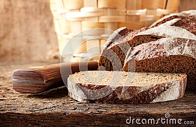 Sliced brown bread with knife