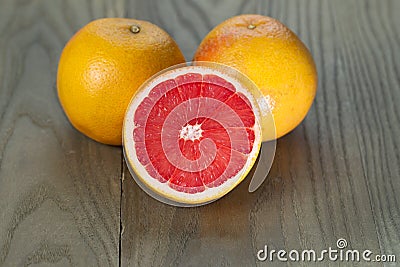 Sliced and Whole Ruby Red Grapefruits