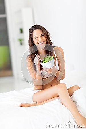 Slim woman eating