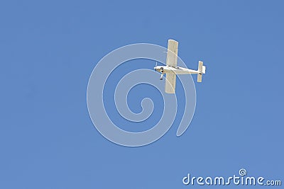Small airplane in the blue sky