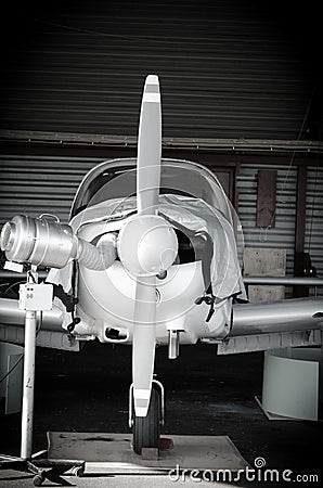 Small airplane in hangar