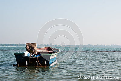 Small boat moored in ocean water