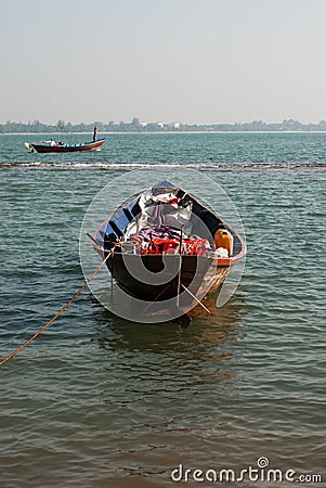 Small boat moored in ocean water