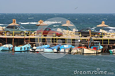 Small boats moored to a jetty