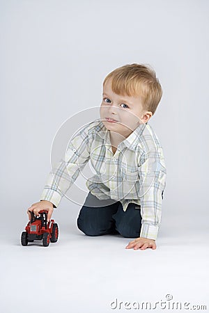 Small boy and toy - car.