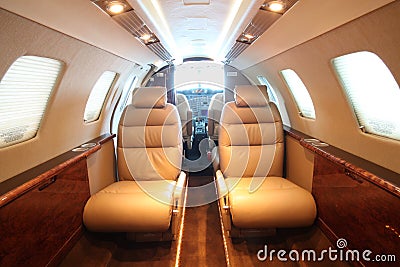 Small business jet cabin - front, cockpit open
