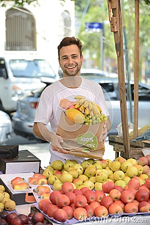 Small business owner selling organic fruits.