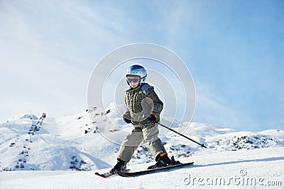 Royalty Free Stock Photos: Small child skiing on snow slope