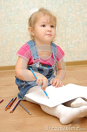 Small cute painting girl at home