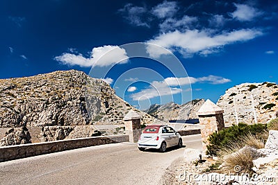 Small european car on winding road of Mallorca