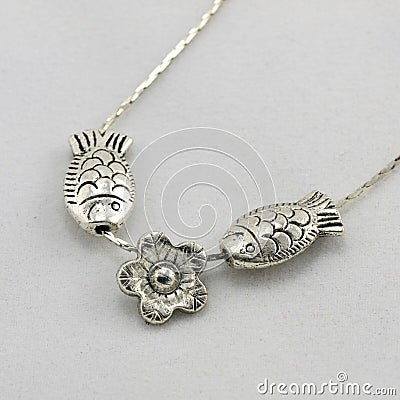 Small fish-shaped silver necklace