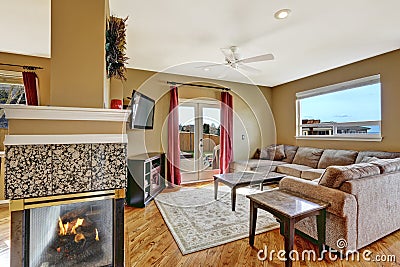 Small living area with fireplace and walkout deck