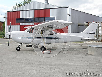 Small plane near hangar