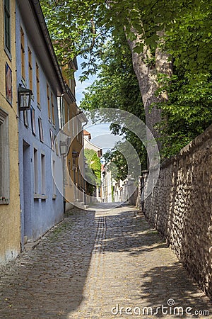 Small road with facade of medieval houses in Weimar