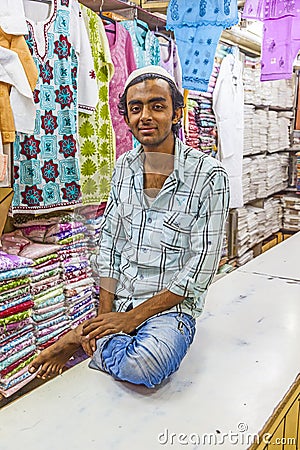 Small shop owner indian man selling