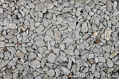 Small stones on a ground with sand for background, design