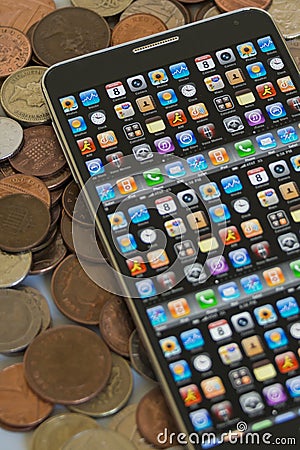Smartphone on cash pile
